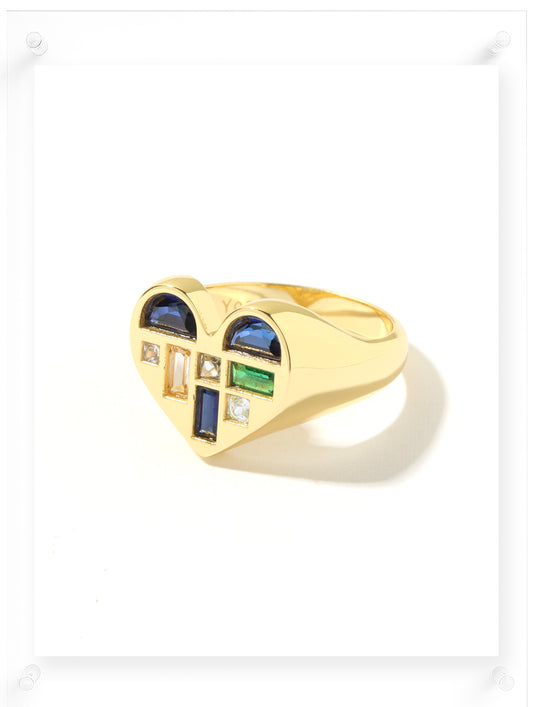 Gold ring with gemstones on a white background