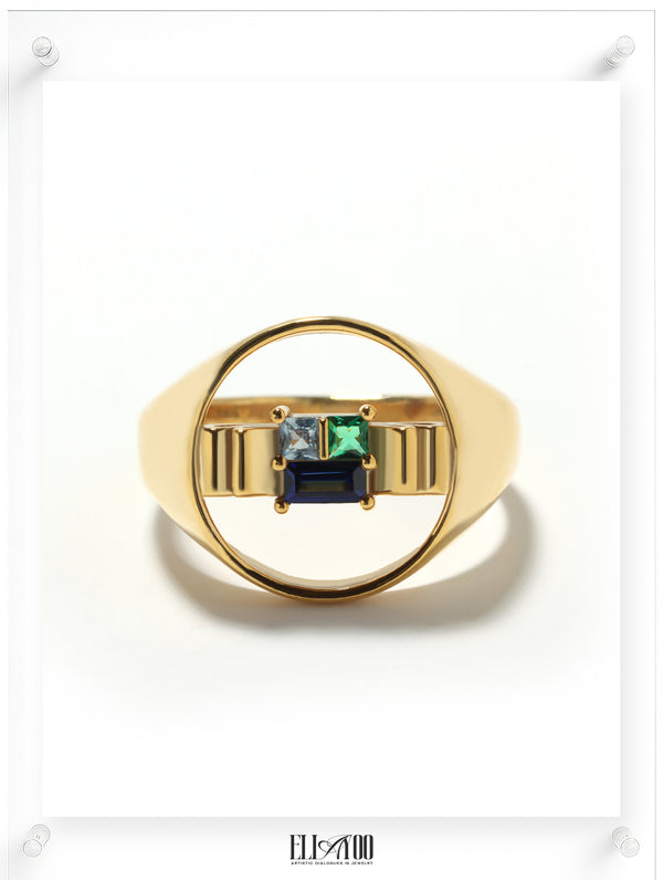 Front image of signet 10k gold ring featuring ribbon shape with Blue Spphire, Emerald, and Aquamarin
