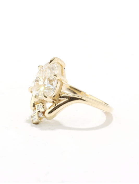 Gold ring with a diamond on a white background