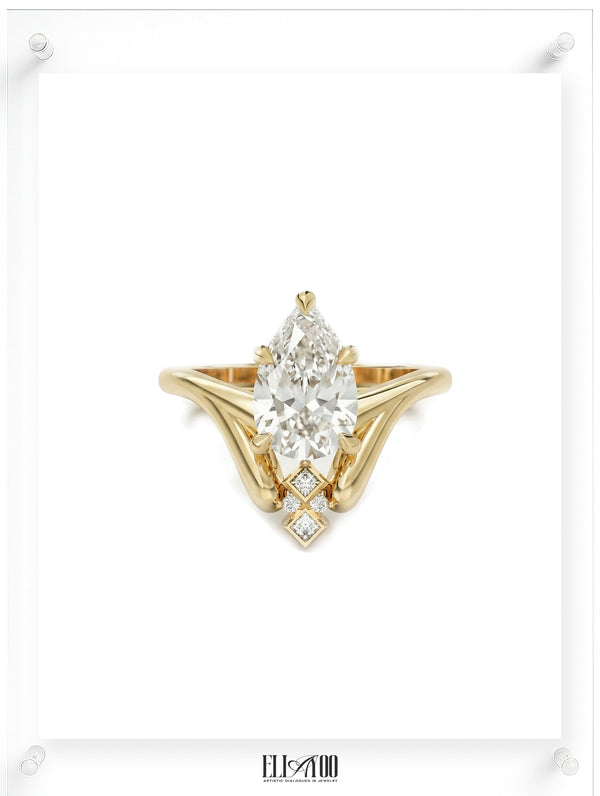 Front shot of 14k Yellow Gold Pear cut Diamond Ring with guard stone detail