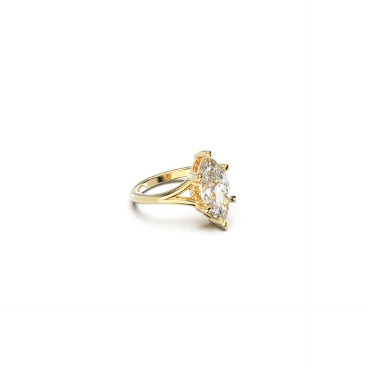 Gold engagement ring with name engraving detail and a large diamond on a white background