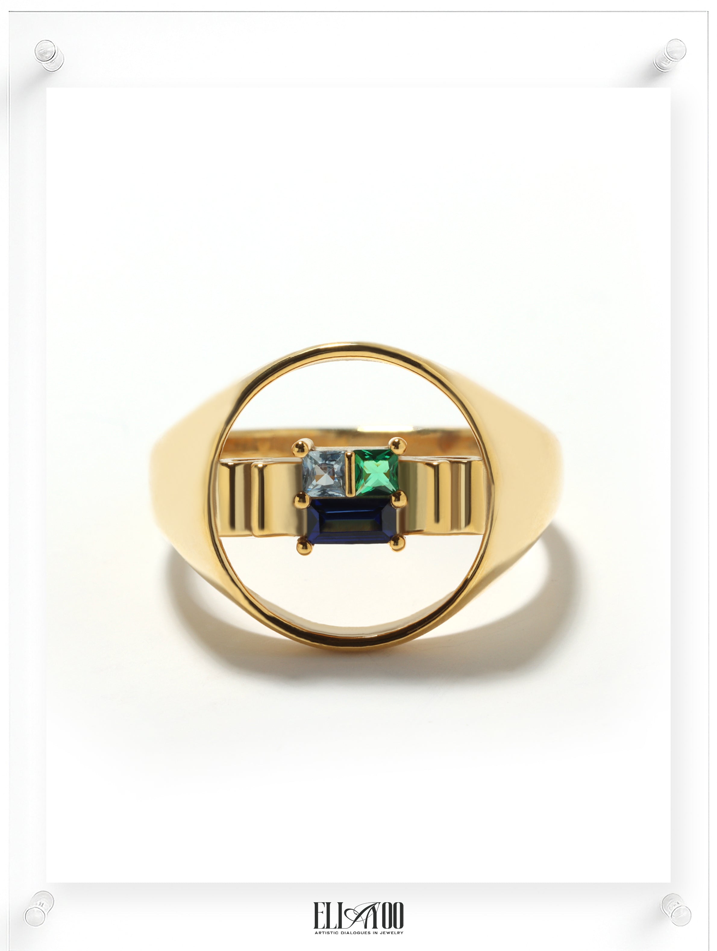 Front image of signet 10k gold ring featuring ribbon shape with Blue Spphire, Emerald, and Aquamarin