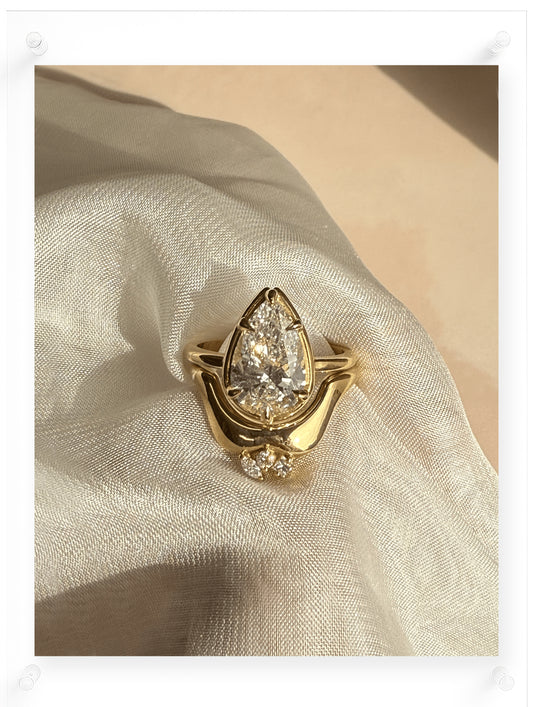 Pear shaped Diamond Engagement Ring with stackable ring details