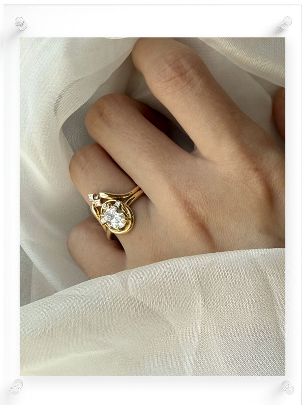 Model shot of 14k Wthie Gold Oval cut Diamond Ring with guard stone detail