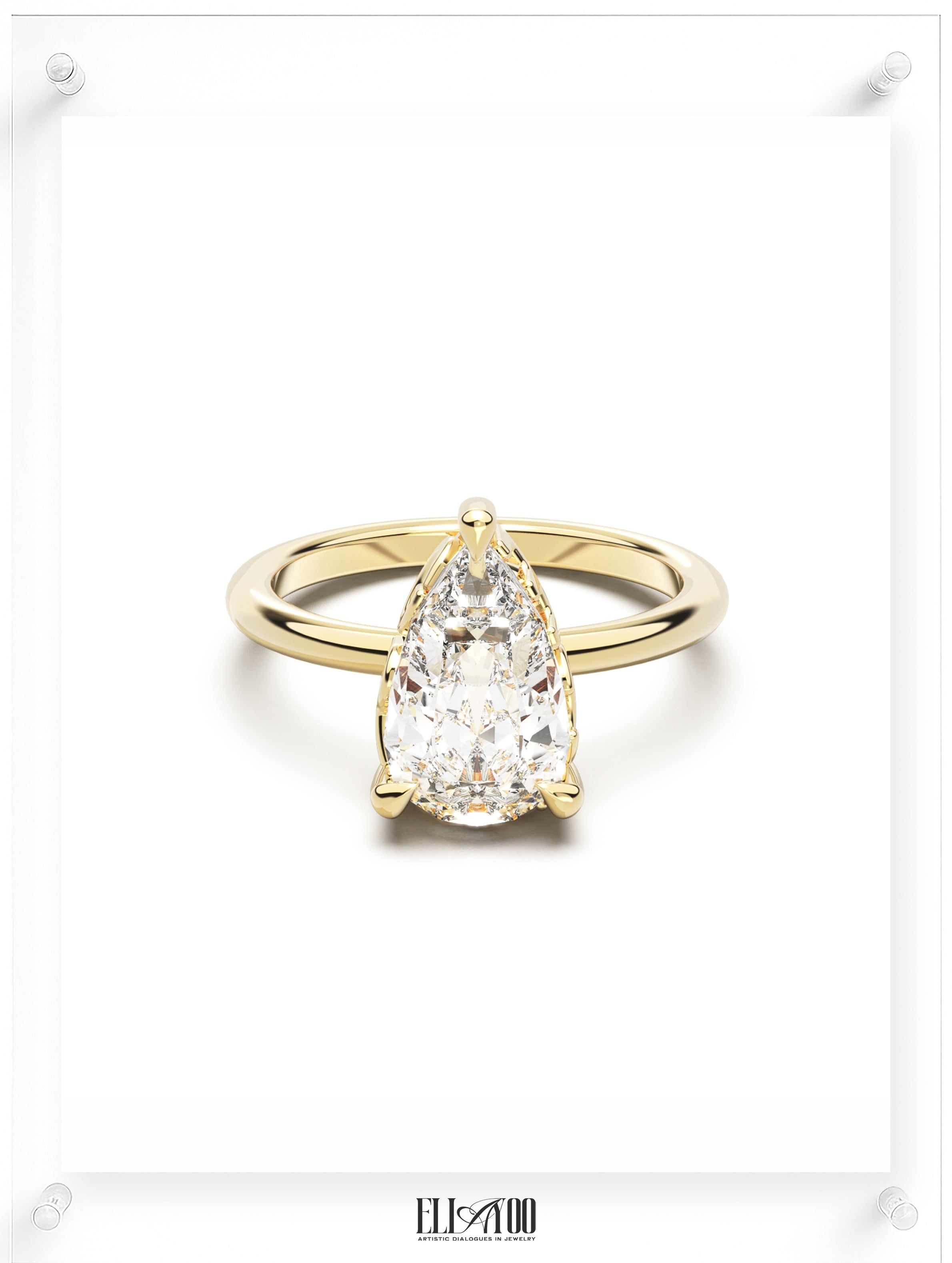 Front view of Pear Cut Diamond Ring with claw setting featuring initials on the side