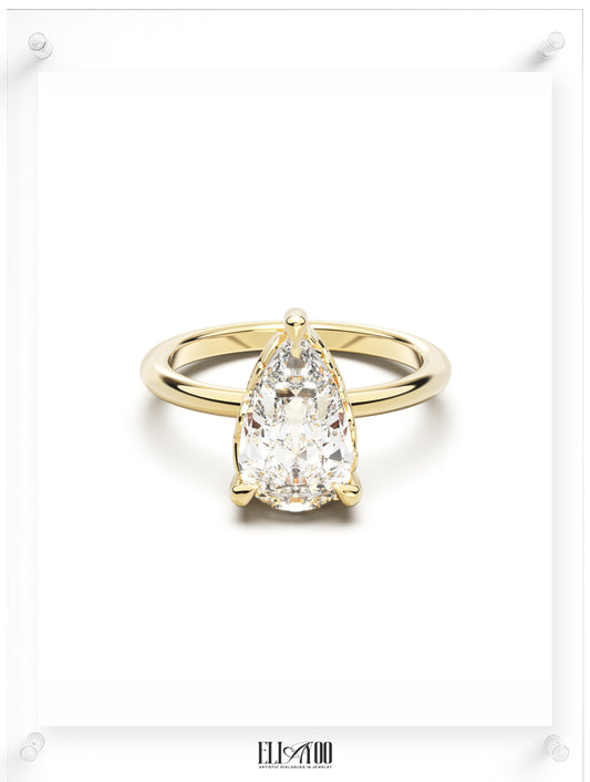 Front view of Pear Cut Diamond Ring with claw setting featuring initials on the side