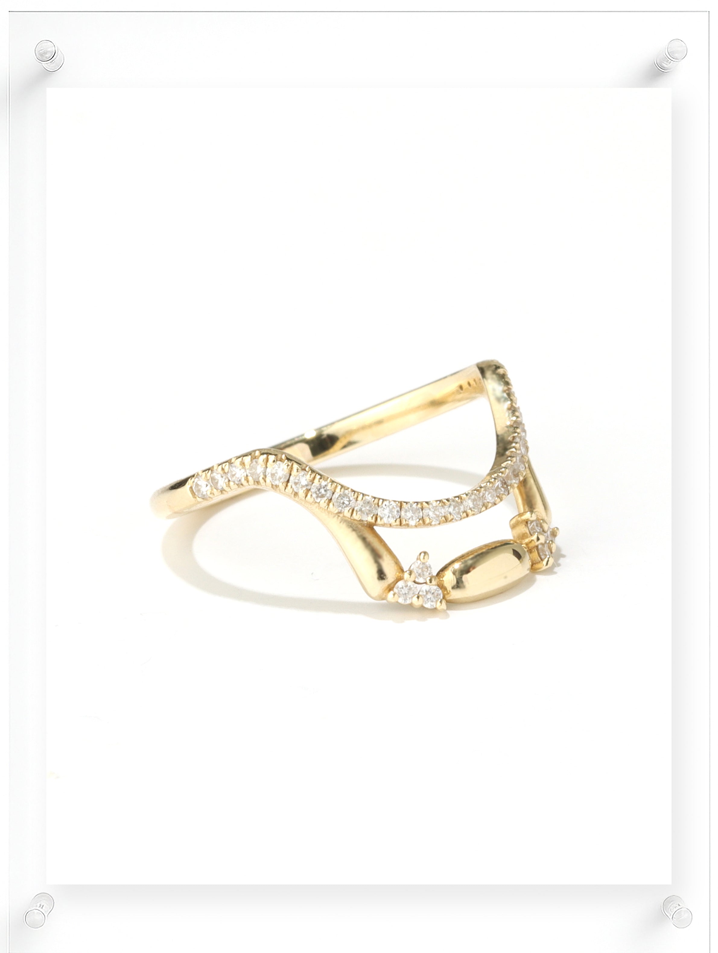 Contemporary yellow gold open ring with pavé diamond details, side view