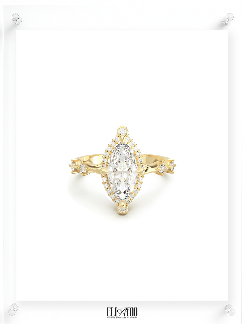 Front view of a yellow gold ring featuring a marquise-cut center diamond surrounded by a delicate halo of round diamonds, with subtle side stone accents, showcasing an elegant fine jewelry design by Ella Yoo Jewelry