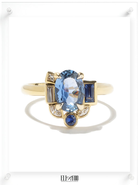 Front shot of Blue Sapphire Gold Ring  featuring asymmetrical halo design