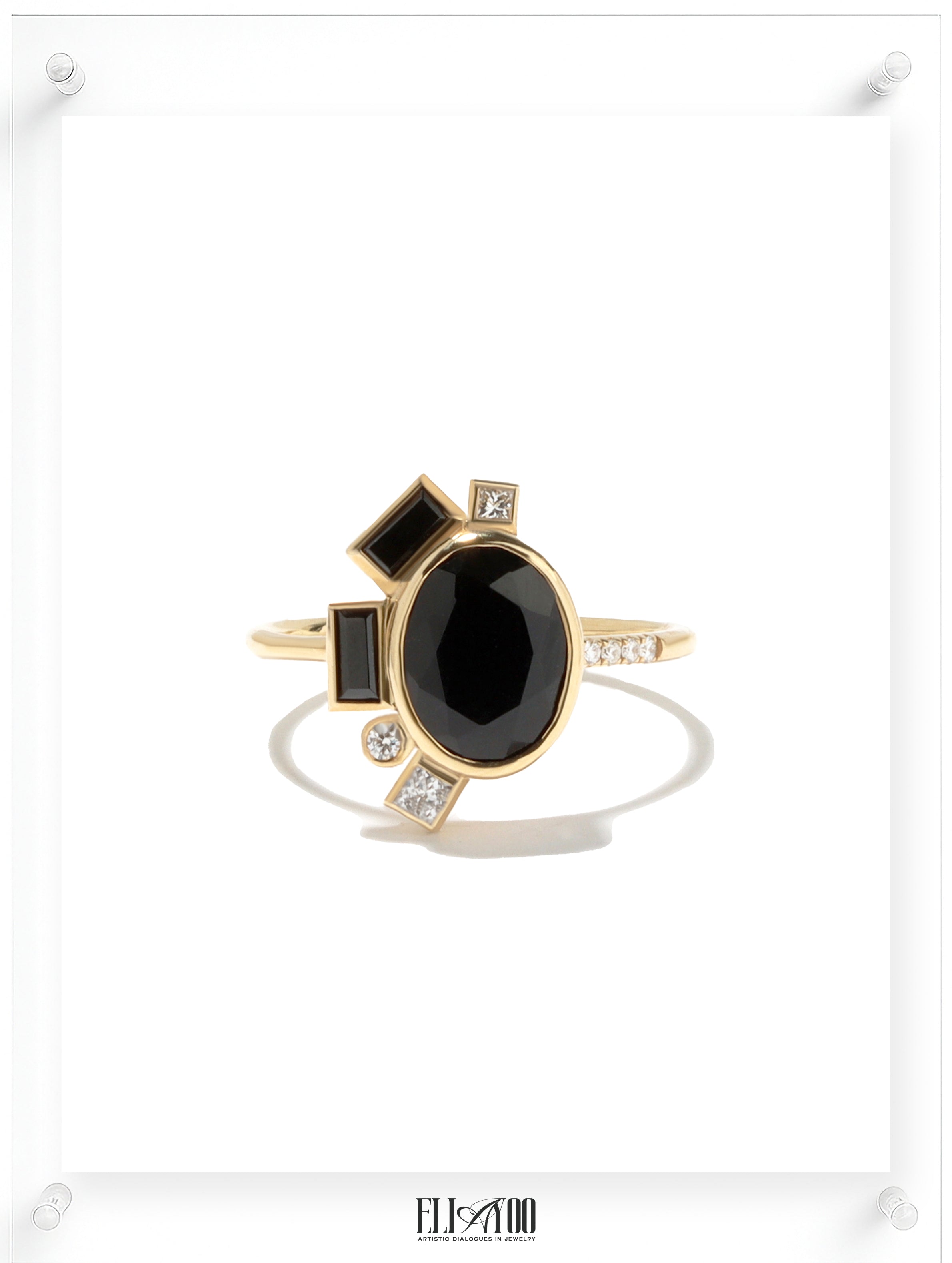 Front shot of Onyx Gold Ring featuring asymmetrical halo design