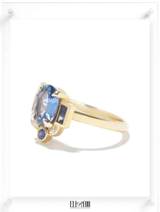 Side shot of Blue Sapphire Gold Ring featuring asymmetrical halo design