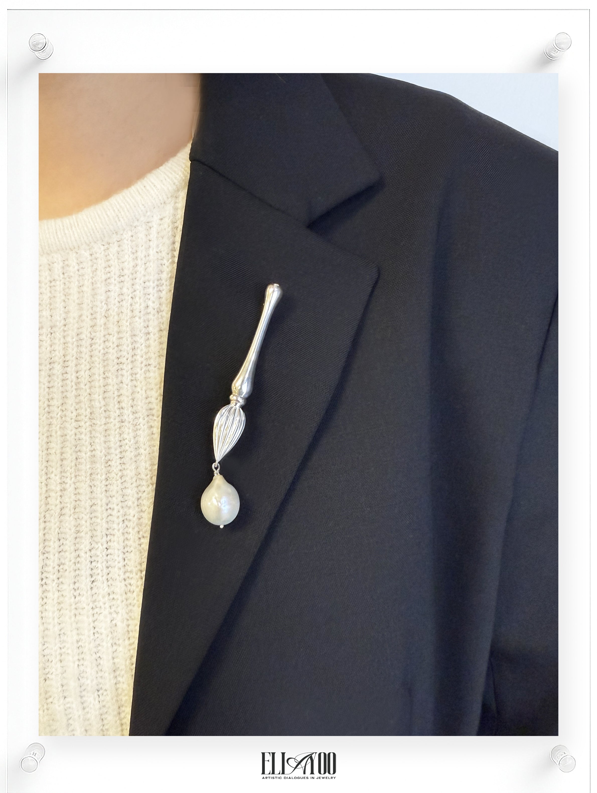 Model view of Silver brooch featuring a paint brush shape with a pearl