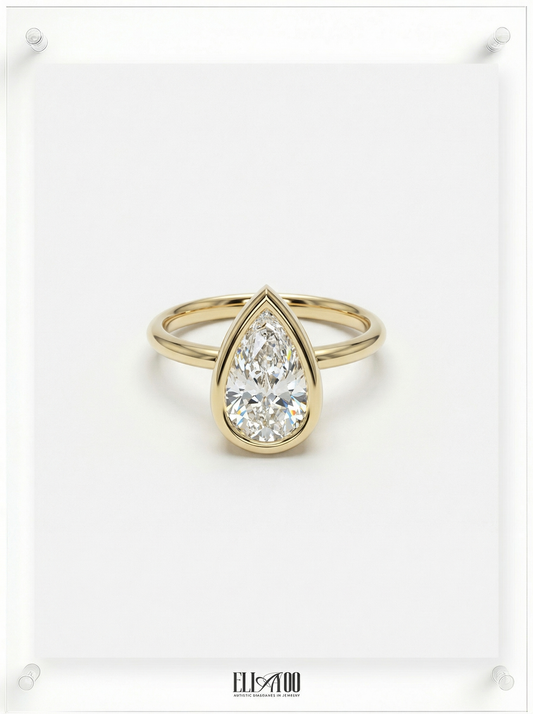 Front view of Pear Cut Diamond Ring with bezel setting featuring initials on the side