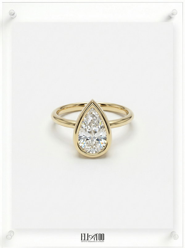 Front view of Pear Cut Diamond Ring with bezel setting featuring initials on the side