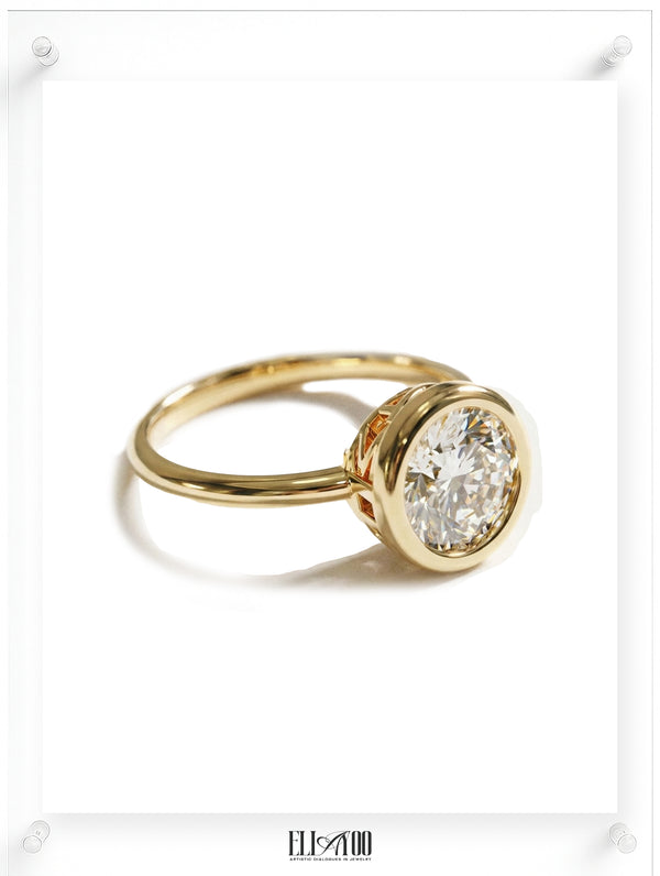 side view of Round Diamond Ring with bezel setting featuring initials on the side