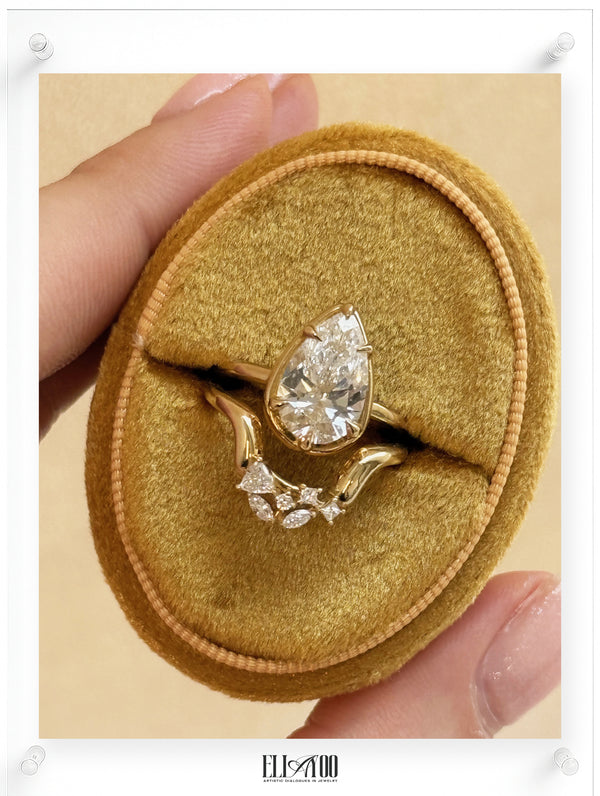 14K Yellow Gold Ring with Pear Shaped Diamond Center and Stackable Diamond Ring