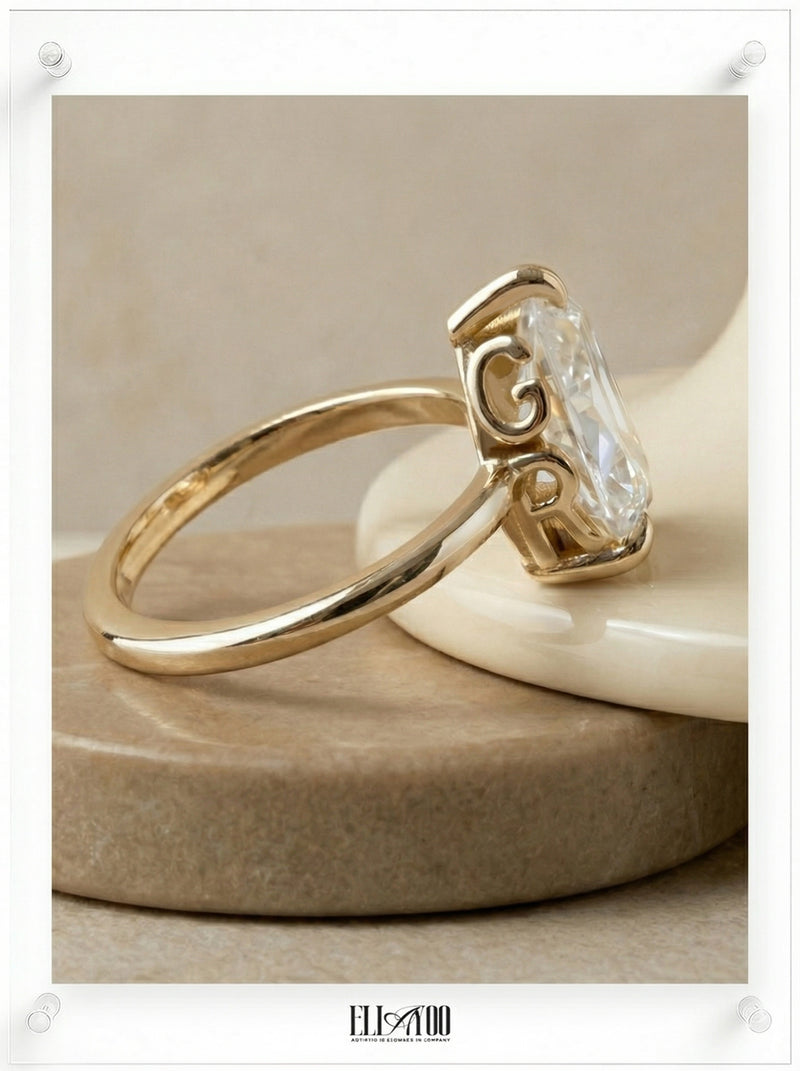 Side view of Pear Cut Diamond Ring with claw setting featuring initials on the side