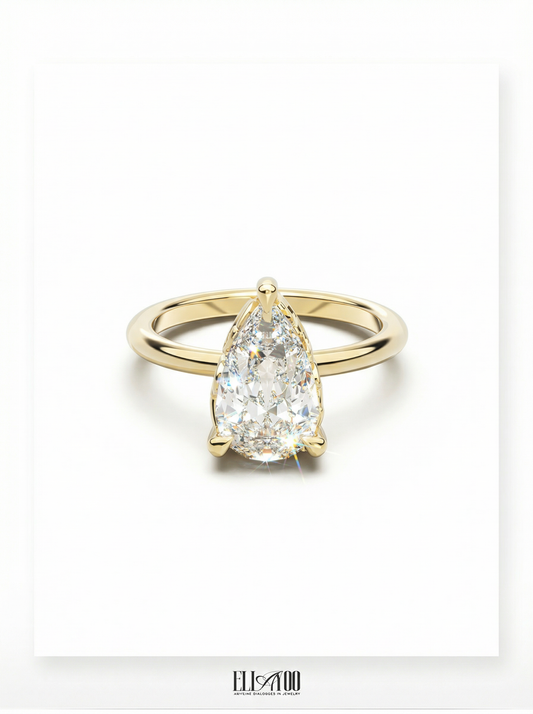 Front view of Pear Cut Diamond Ring with claw setting featuring initials on the side
