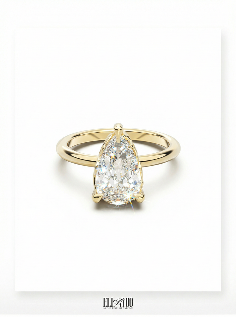 Front view of Pear Cut Diamond Ring with claw setting featuring initials on the side