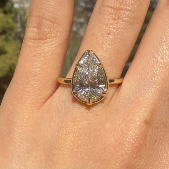 Model wearing Pear cut diamond white gold ring