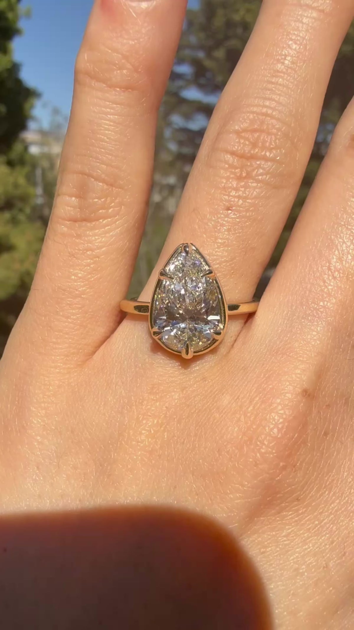 Model wearing Pear cut diamond white gold ring